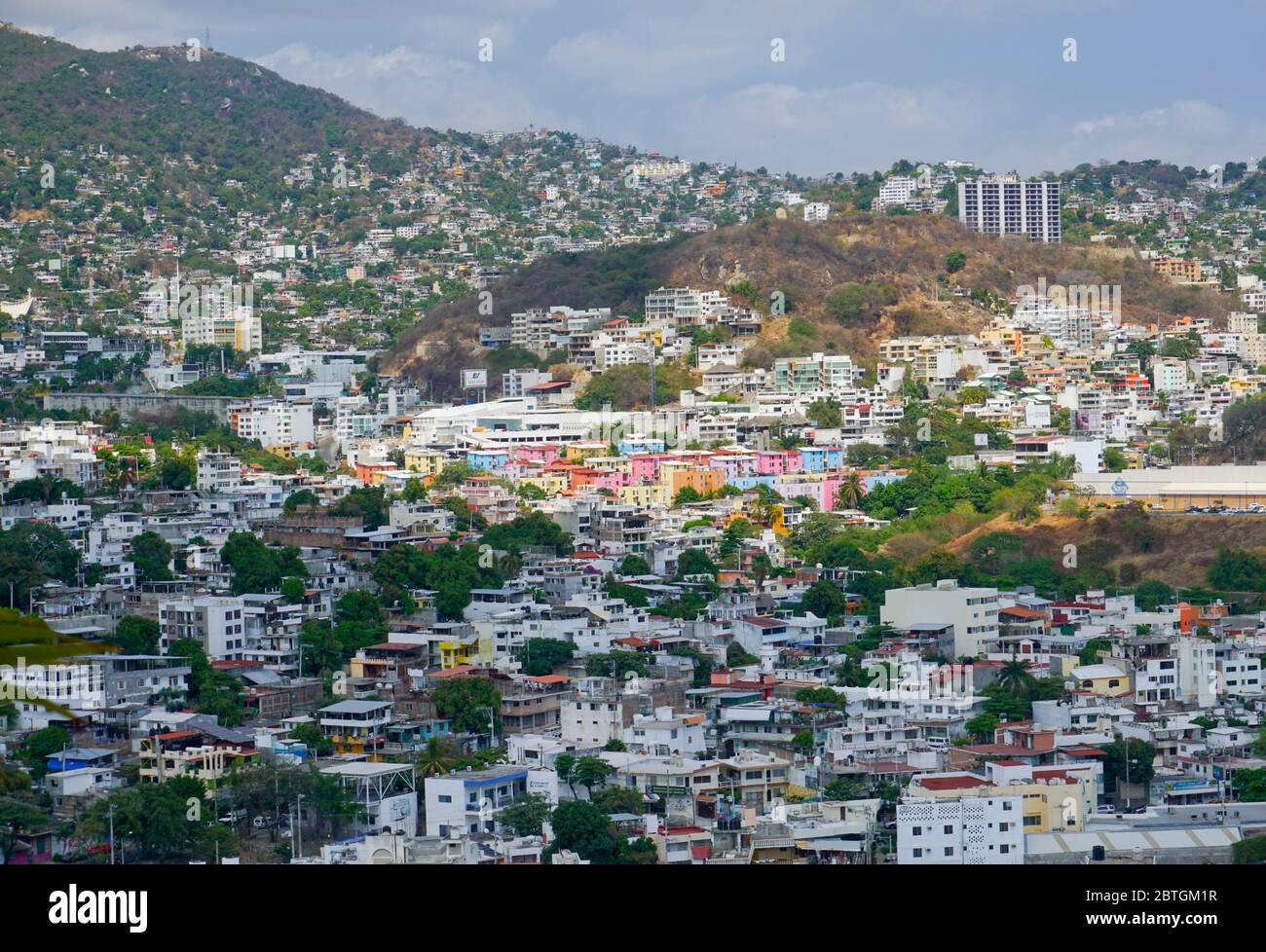 Hillside homes on the foothills of the Sierra Madre del Sur mountains, Acapulco, Mexico Stock Photo