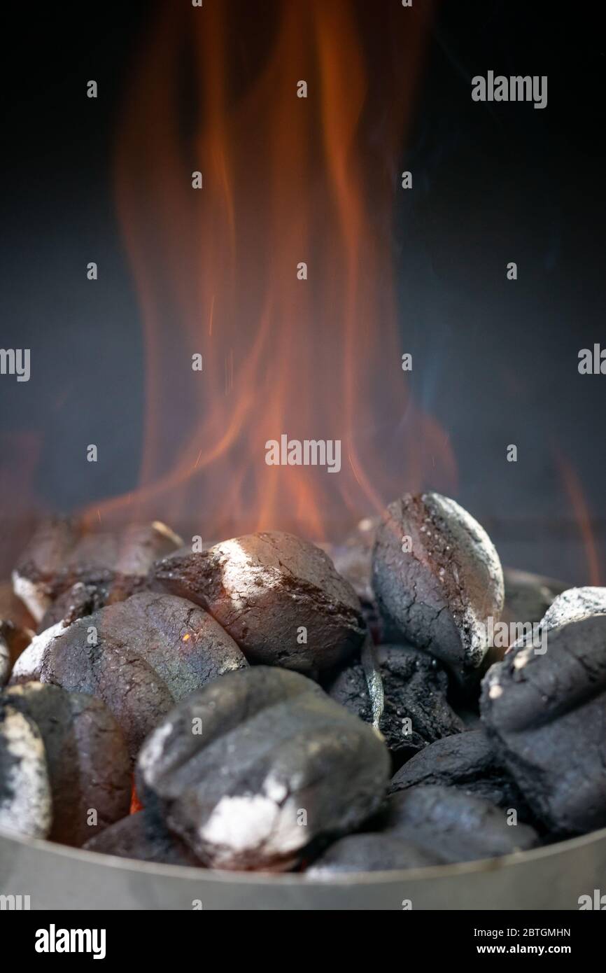 Hot charcoal burning in a grill Stock Photo Alamy