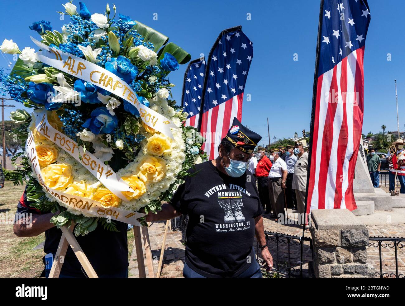 Veterans wearing face masks as a preventive measure against the spread of COVID 19 pandemic  participate in a Memorial Day Ceremony in Los Angeles.The event took place at the Los Cinco Puntos/Five Points Memorial that honours Mexican American soldiers who died in the World War II, the Korean War, and the Vietnam War. Stock Photo