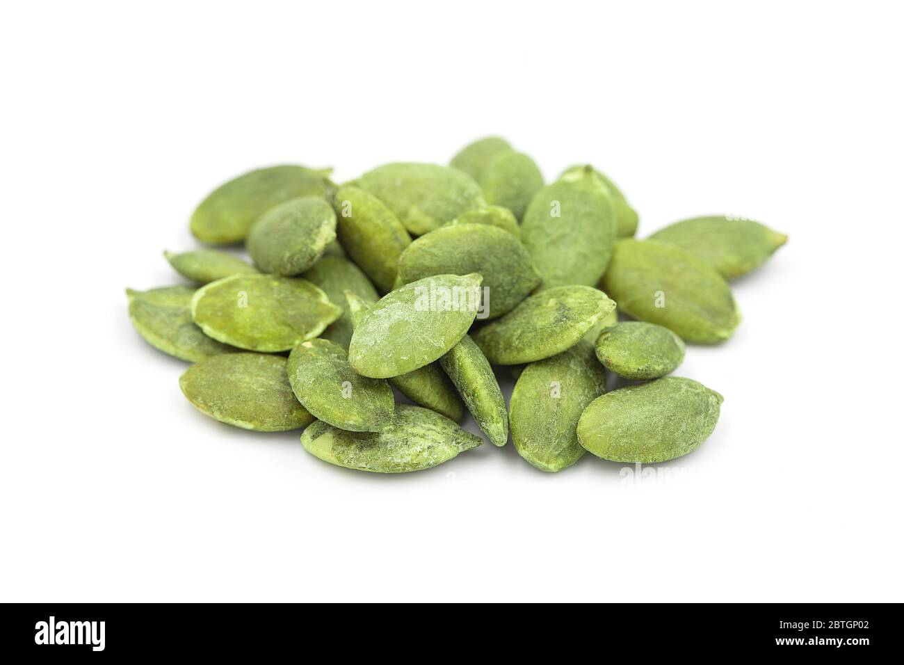 Organic roasted pumpkin seed or pepita on white isolated background