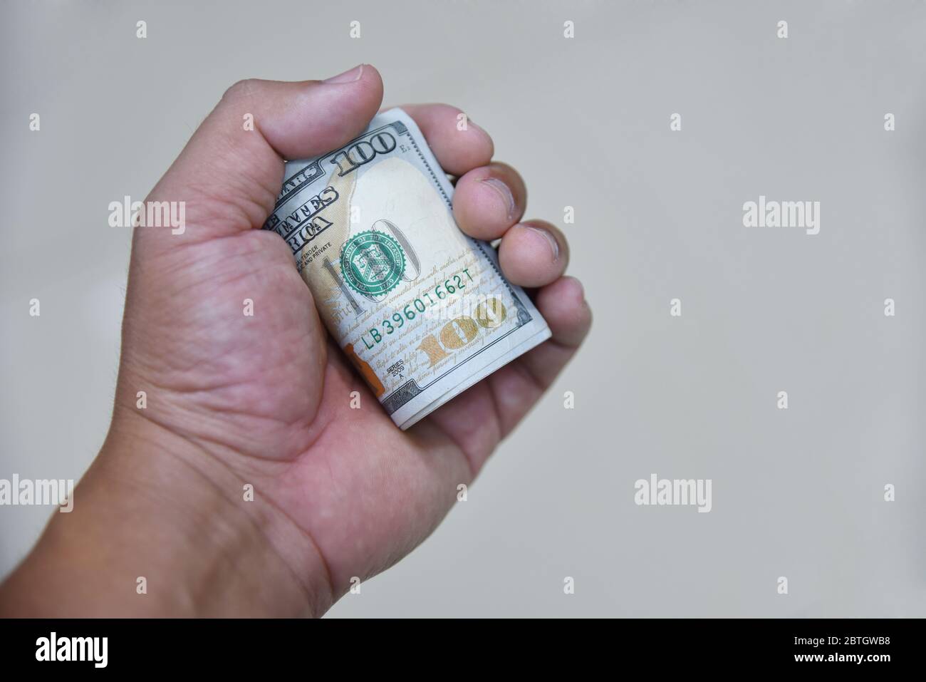 Dollars bills in hand. Texture background American bills money dollars in hand. Image of money 100 us dollars in hand. Exchange rate concept. Stock Photo