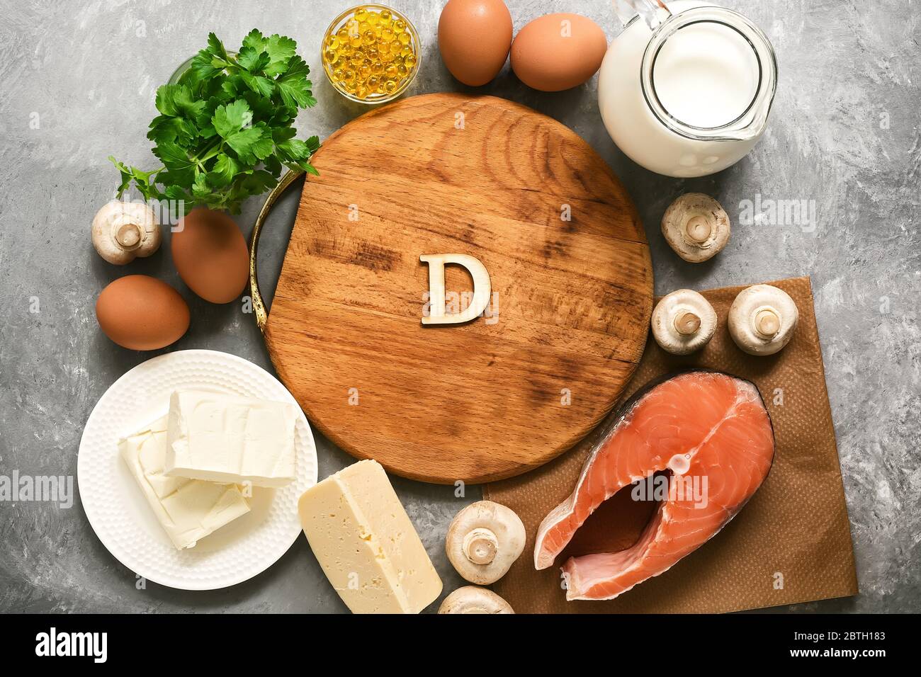 Empty cutting board and frame of varied food rich in vitamin D. Healthy eating concept. Top view, flat lay Stock Photo