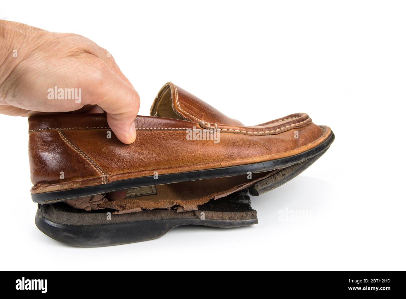 Torn leather shoes on a white background Stock Photo Alamy