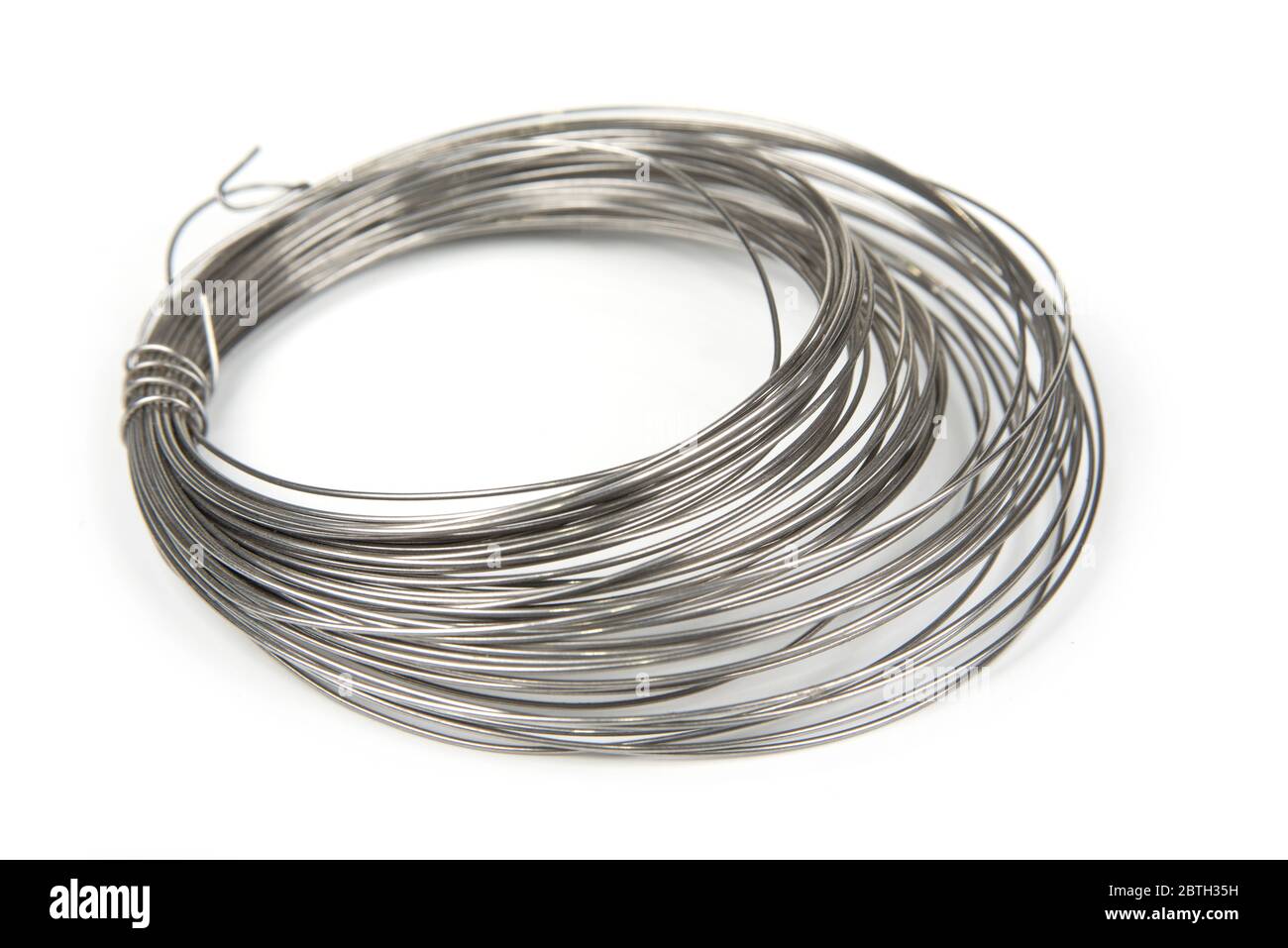 Stainless steel wire roll on a white background Stock Photo Alamy