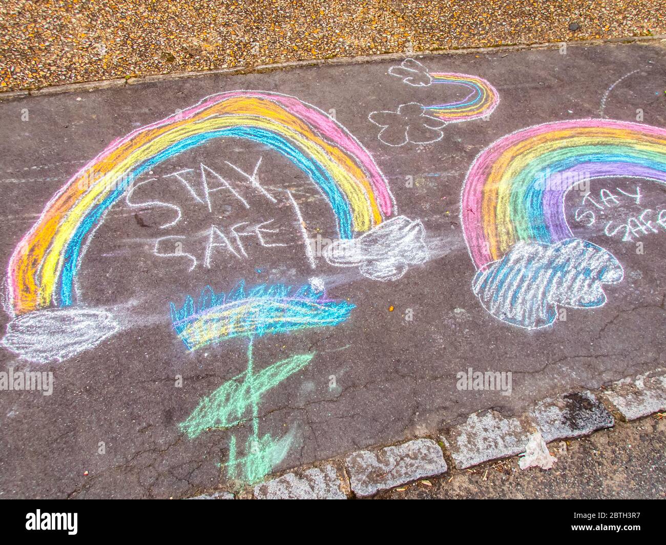 Stay Safe Chalk Drawing on Pavement Made by children at the time of lockdown with the corona virus cover 19 Stock Photo