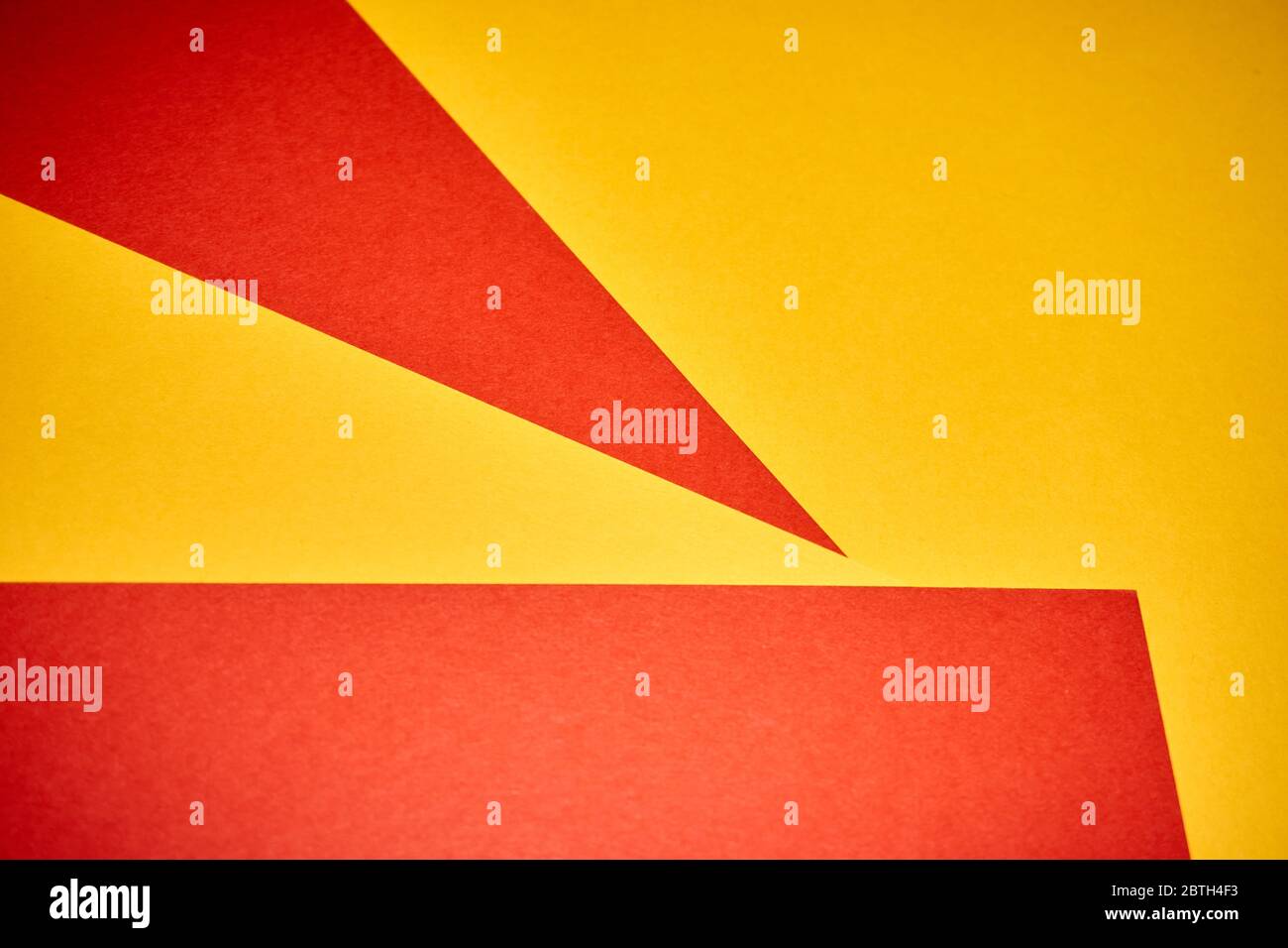 Colorful geometric texture paper pattern in yellow, red Stock Photo - Alamy