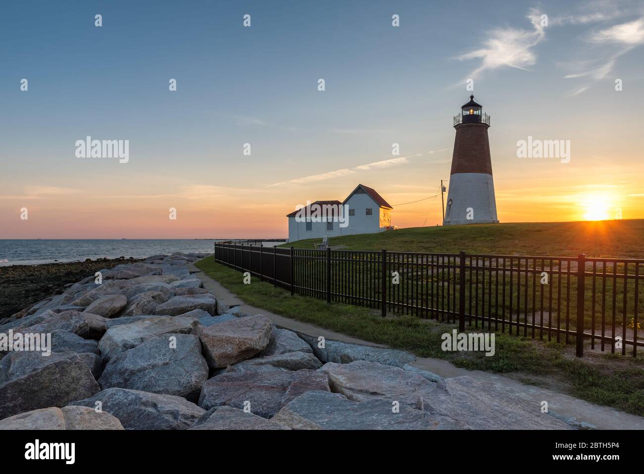 The Point Judith lighthouse at sunset near Narragansett, Rhode Island Stock Photo