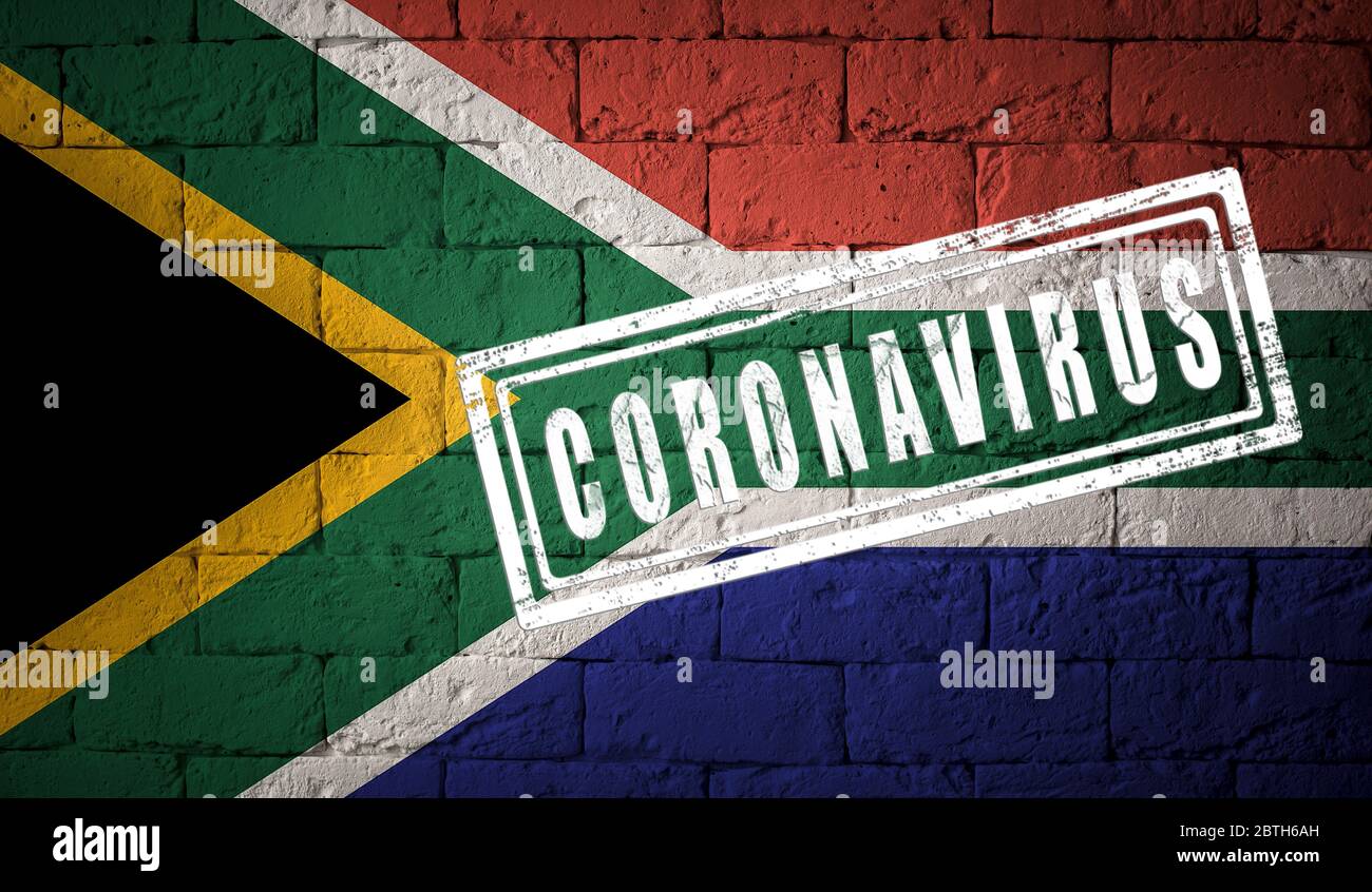 Flag of the South Africa with original proportions. stamped of Coronavirus. brick wall texture. Corona virus concept. On the verge of a COVID-19 or 20 Stock Photo