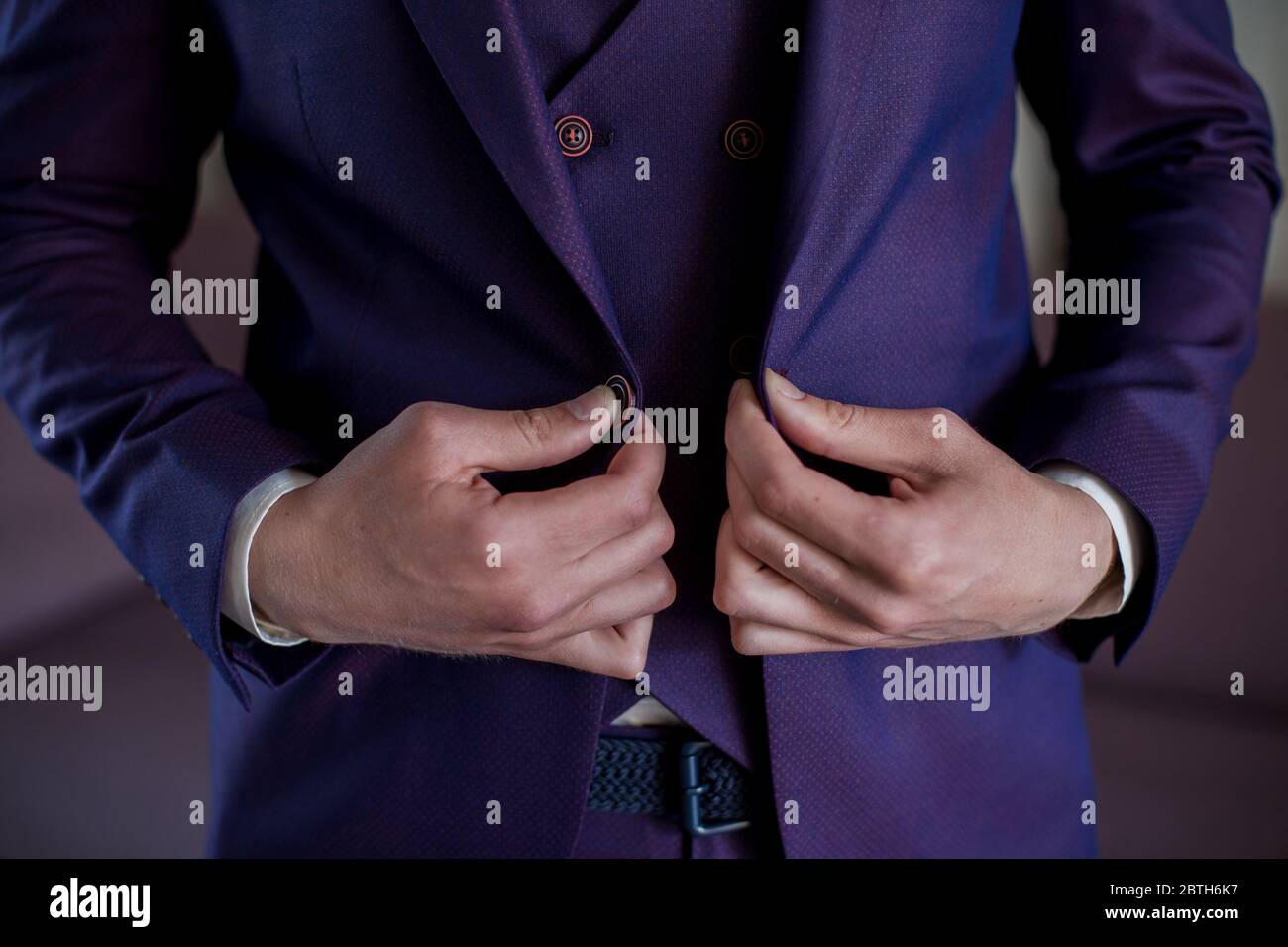 Man puts on suit jacket hi-res stock photography and images - Alamy