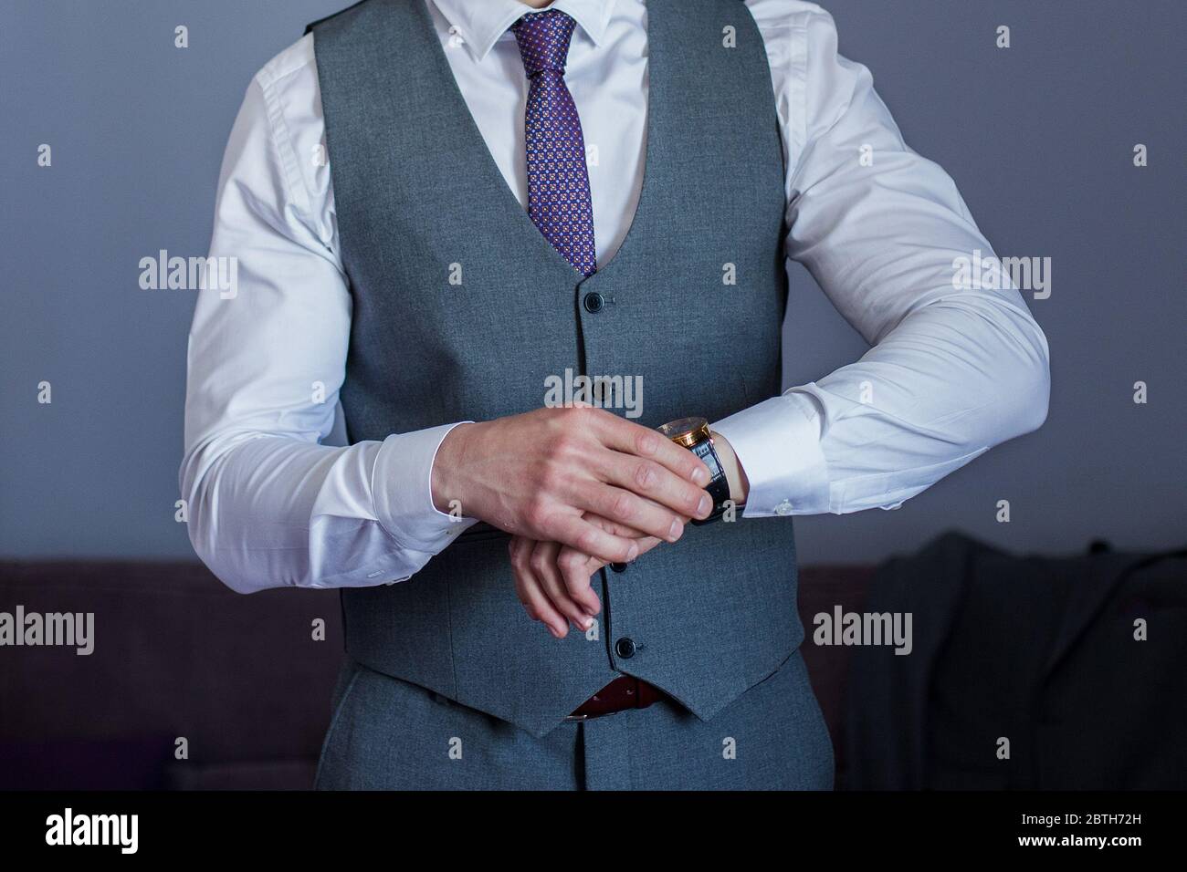 Man puts on suit jacket hi-res stock photography and images - Alamy
