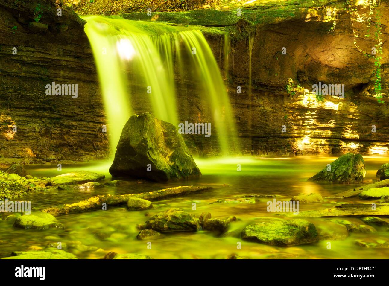 Silky waterfall, creek and rocks in forest. Stock Photo