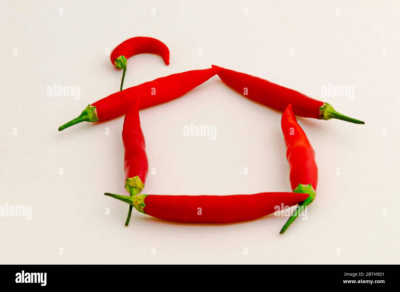 Sign or symbol House, made from the fruit of fresh chilli red pepper with a green stalk, Sofia, Bulgaria Stock Photo