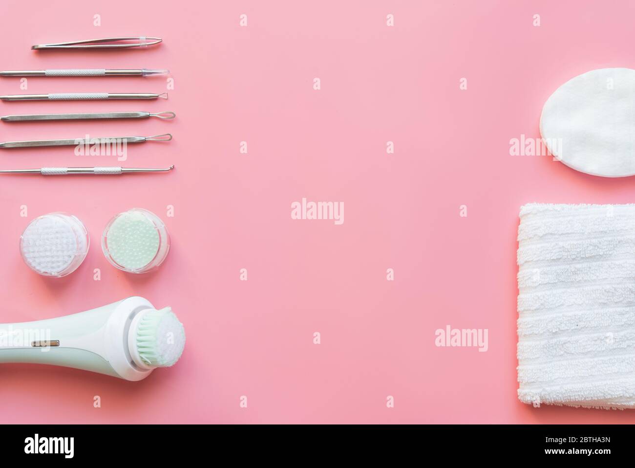 Tools of the cosmetologist for problem skin on pink paper background. Stock Photo