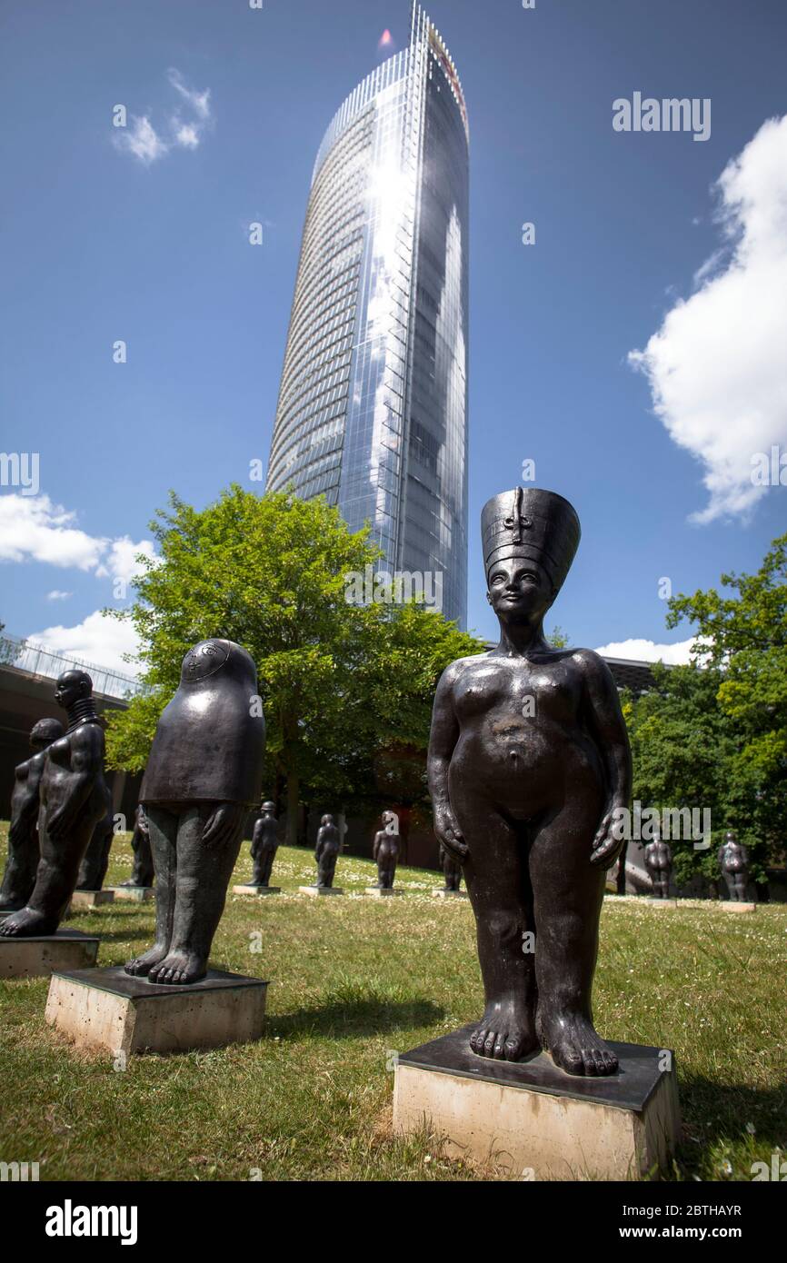 the group of figures called Frauen De Formation by Tina Schwichtenberg in front of the Post Tower, headquarters of the logistics company Deutsche Post Stock Photo