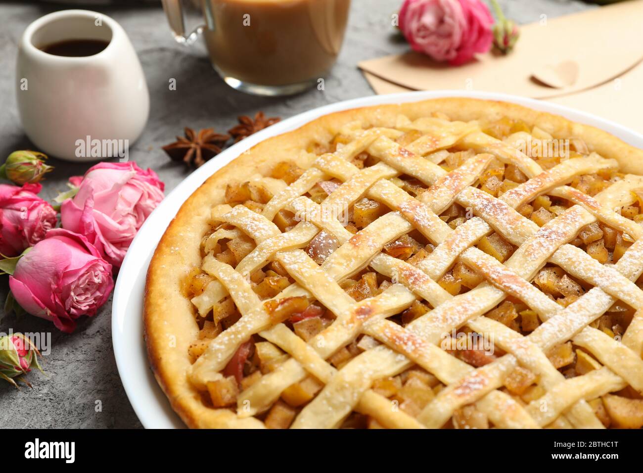 Composition with apple pie on gray background. Homemade food Stock Photo