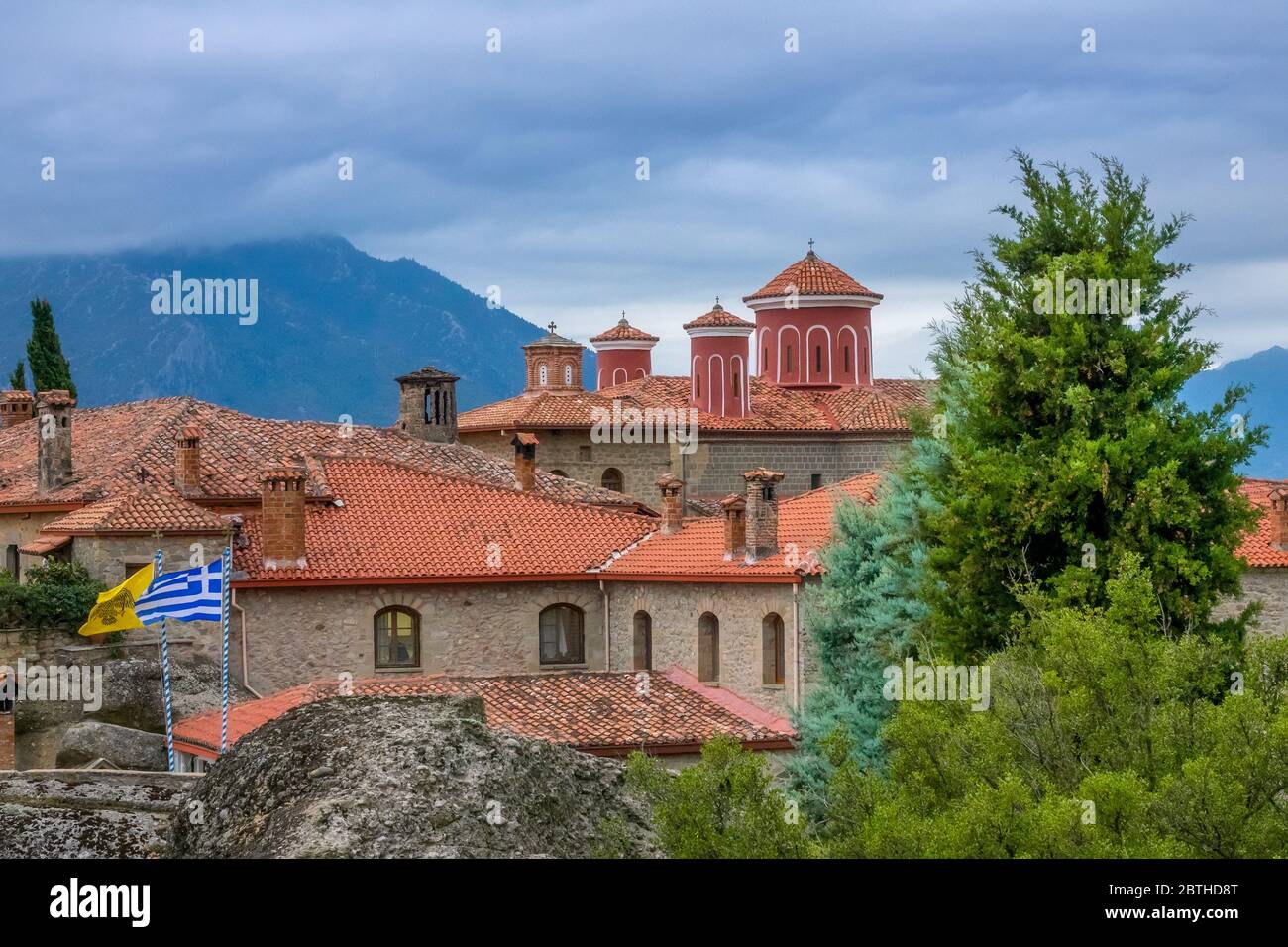 Greece. Summer cloudy day in Meteora. Red roofs and crosses on a greek monastery Stock Photo