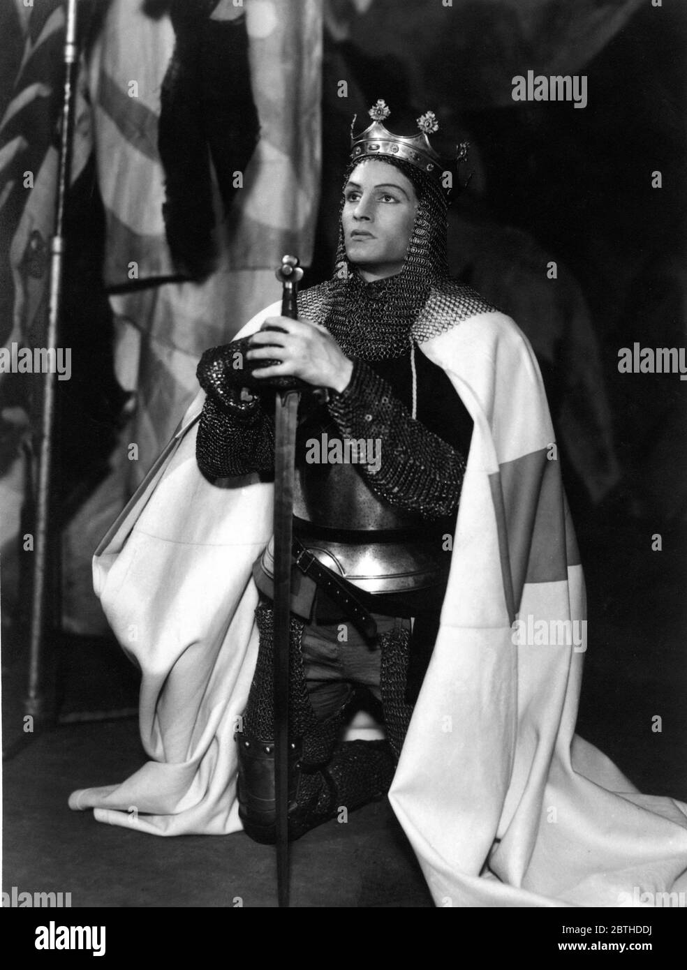 LAURENCE OLIVIER Portrait by J. W. DEBENHAM in HENRY V 1937 play by William Shakespeare produced by TYRONE GUTHRIE manager LILIAN BAYLIS last production of 1936-37 Season at the Old Vic Theatre in Waterloo London Stock Photo