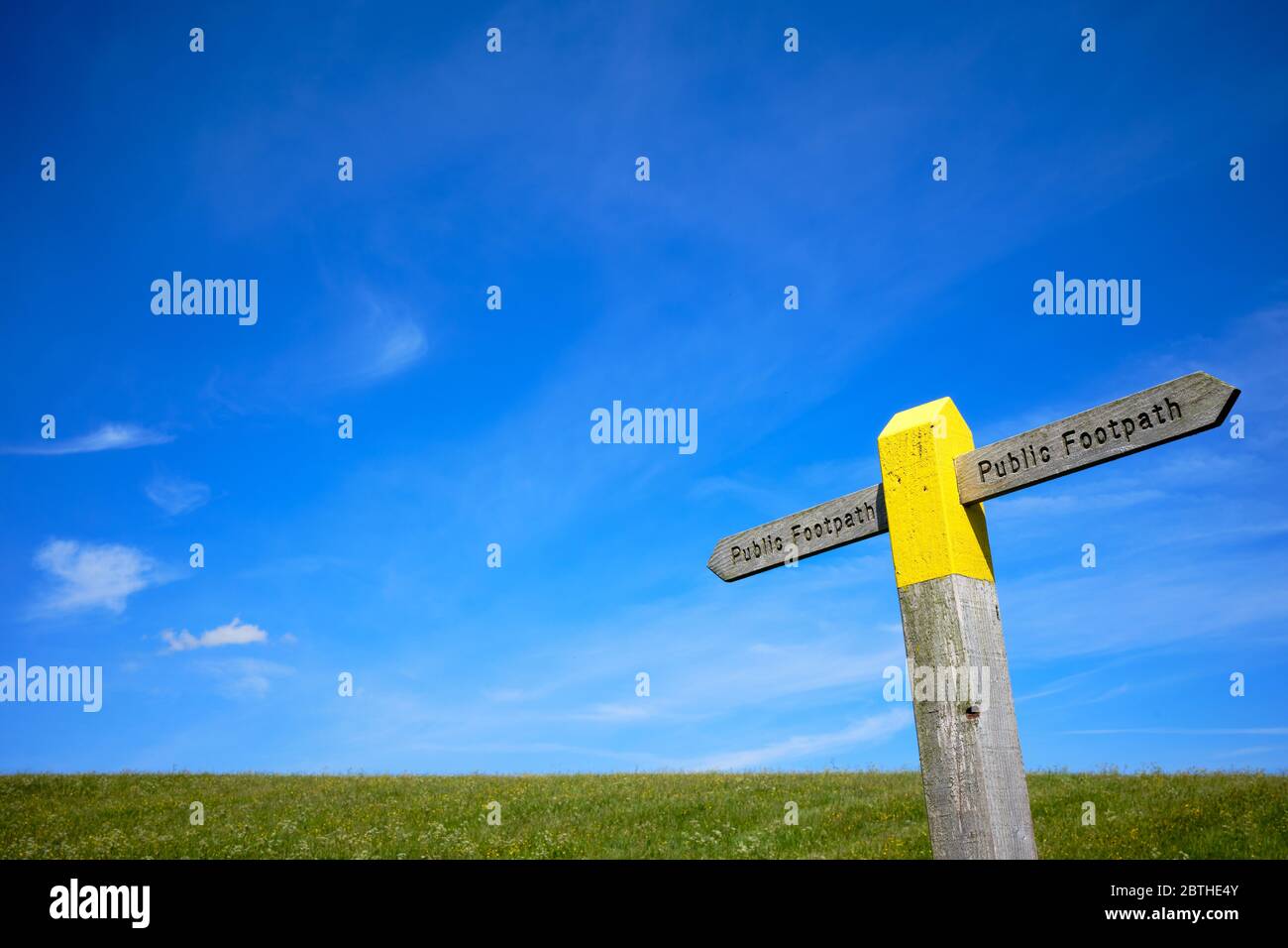 Public Right Of Way Near Me A Yellow Painted Wooden Public Footpath Sign Against A Blue Sky In A Green  Meadow Near Grassington In The Yorkshire Dales National Park Stock Photo -  Alamy