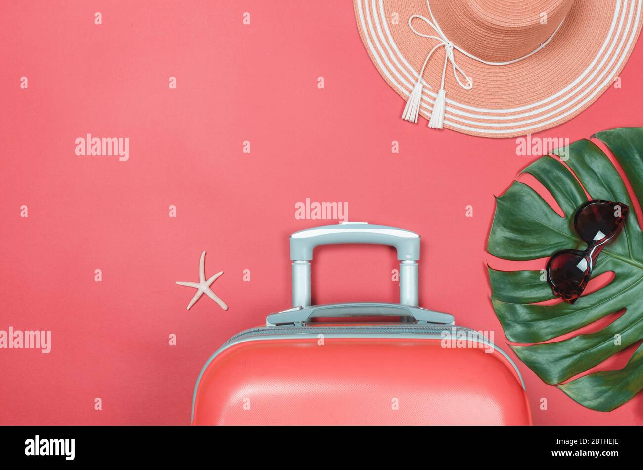 Summer straw hat, travel bag starfish and sunglasses on a bright background. flatlay Stock Photo
