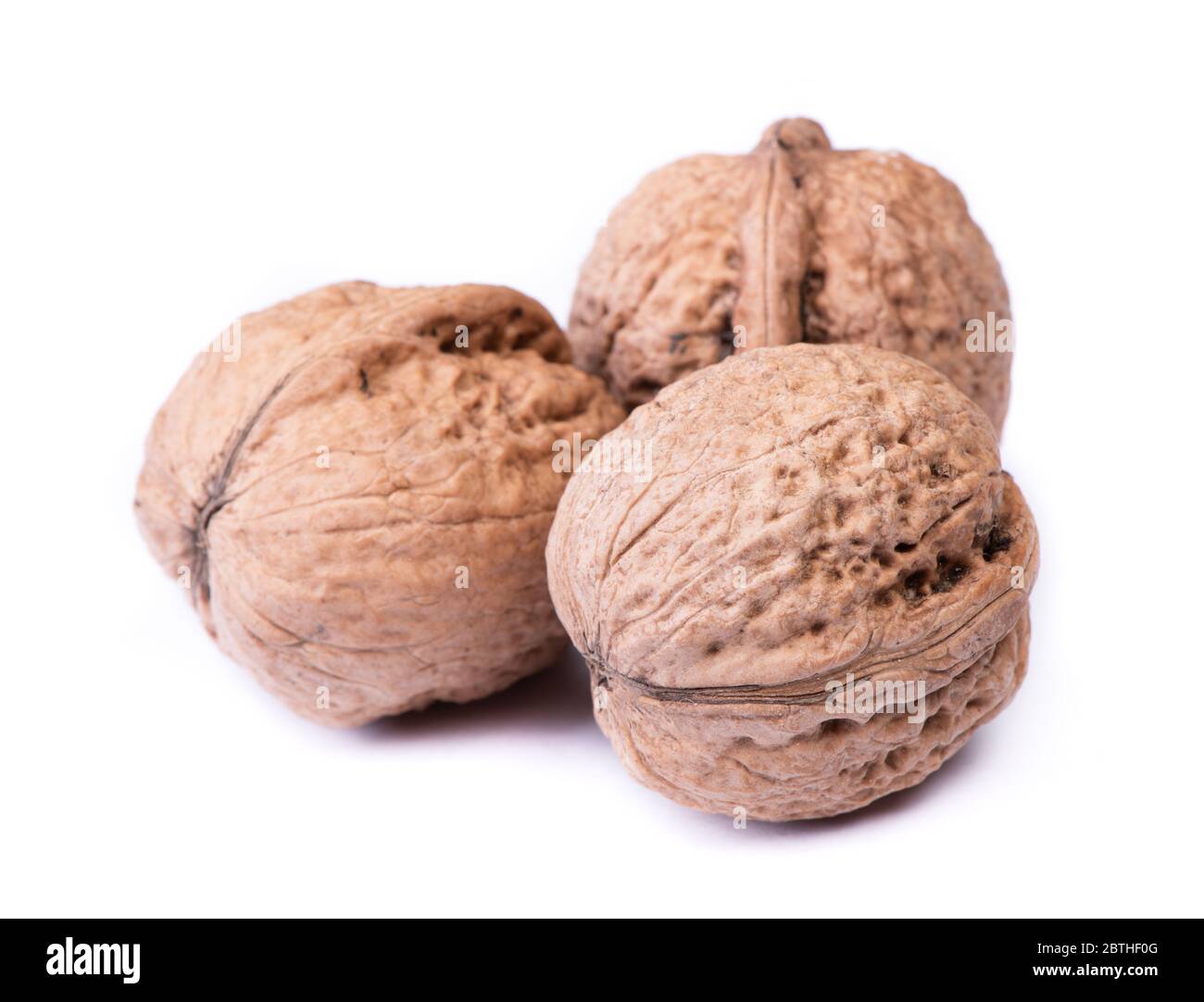 Few big walnuts isolated on white background Stock Photo