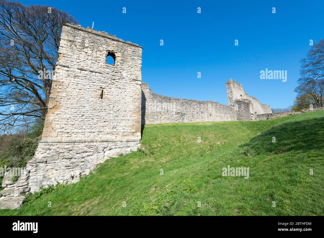 Winter view of the Mill Tower, walls and outer gatehouse of Pickering Castle in North Yorkshire Stock Photo
