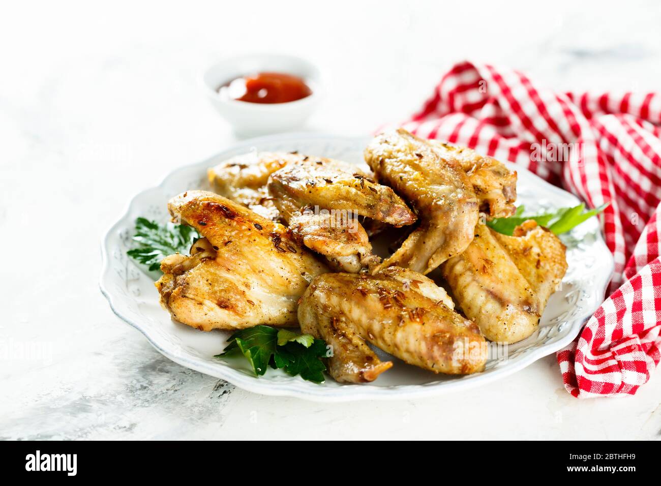 Roasted chicken wings with spices Stock Photo Alamy
