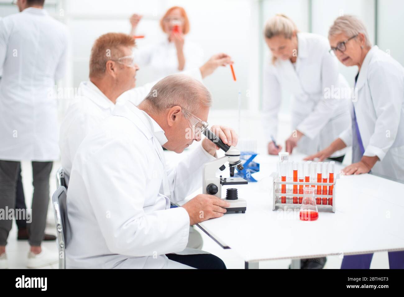 group of scientists conduct testing in the laboratory Stock Photo Alamy