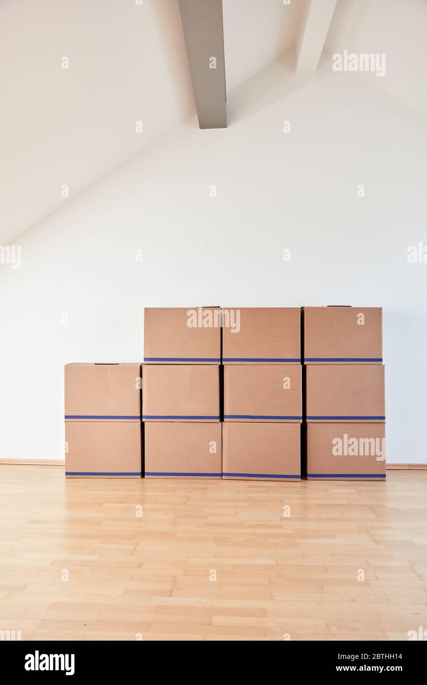 Moving boxes on wall in a bright apartment or office after moving in