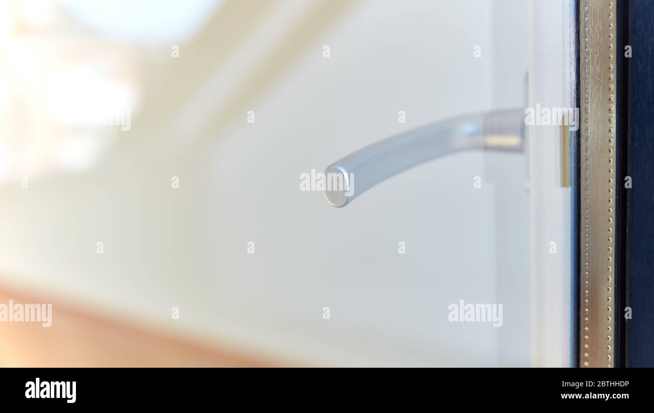 Doorknob through window on open door from outside of house to terrace