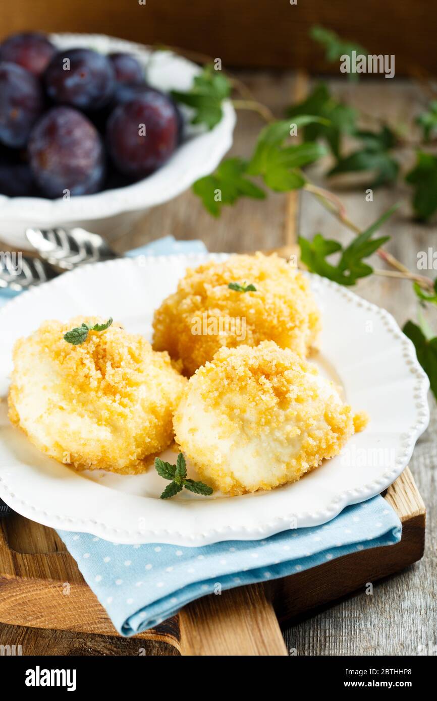 Traditional homemade sweet Austrian dumplings with plums Stock Photo