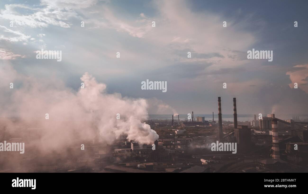 smoke from the chimney. view point of smoking chimney with orange white colors Stock Photo