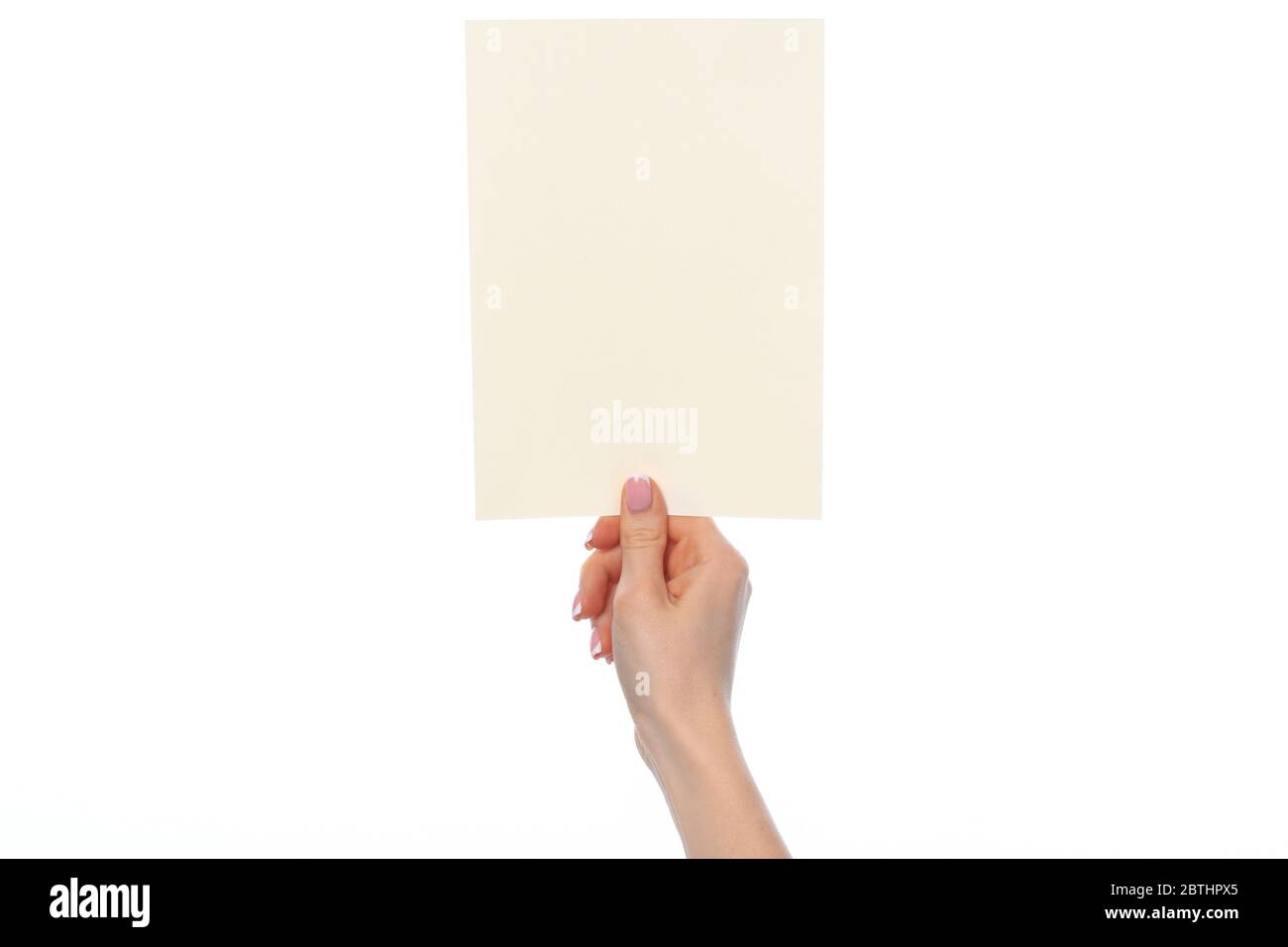 Female hand holding blank white sheet of paper isolated on white Stock ...
