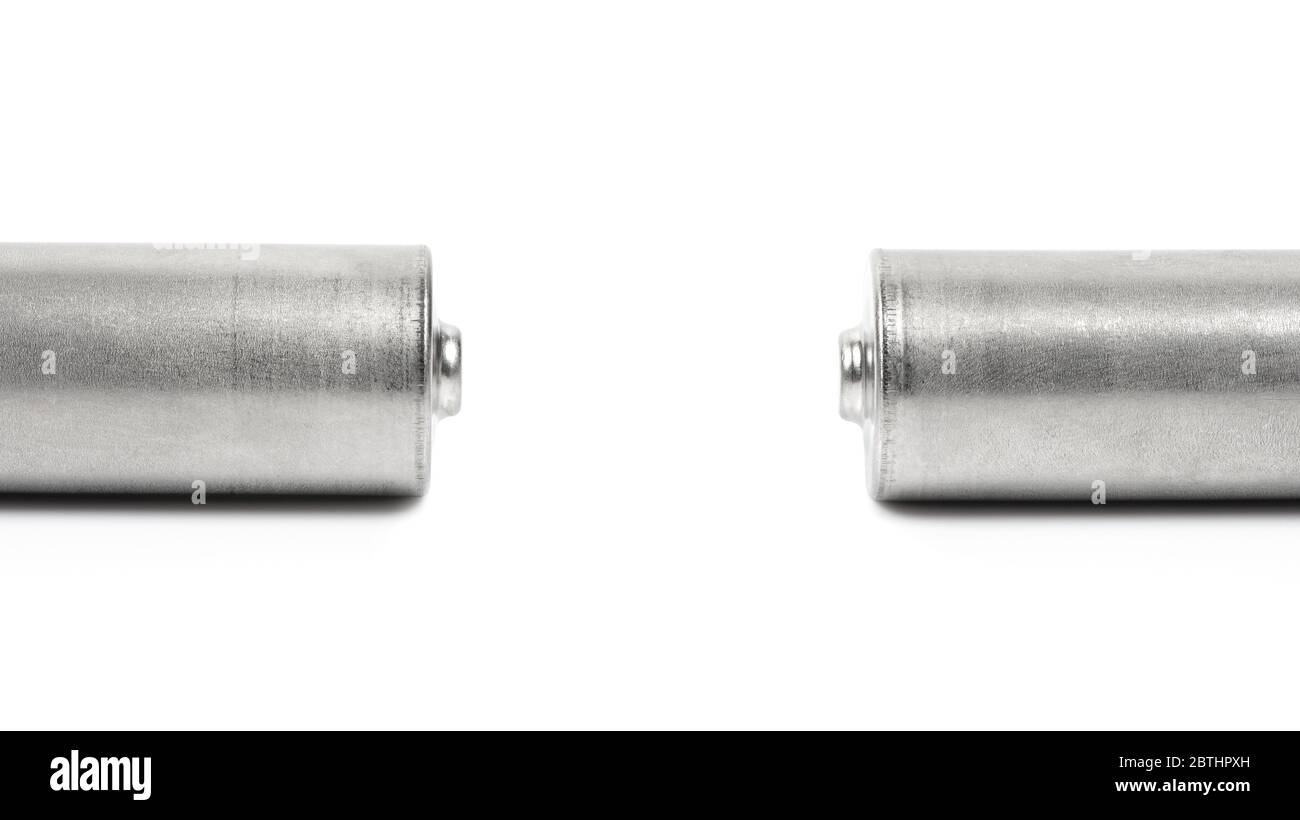 Close up of the positive poles of two batteries isolated on white background with clipping path Stock Photo