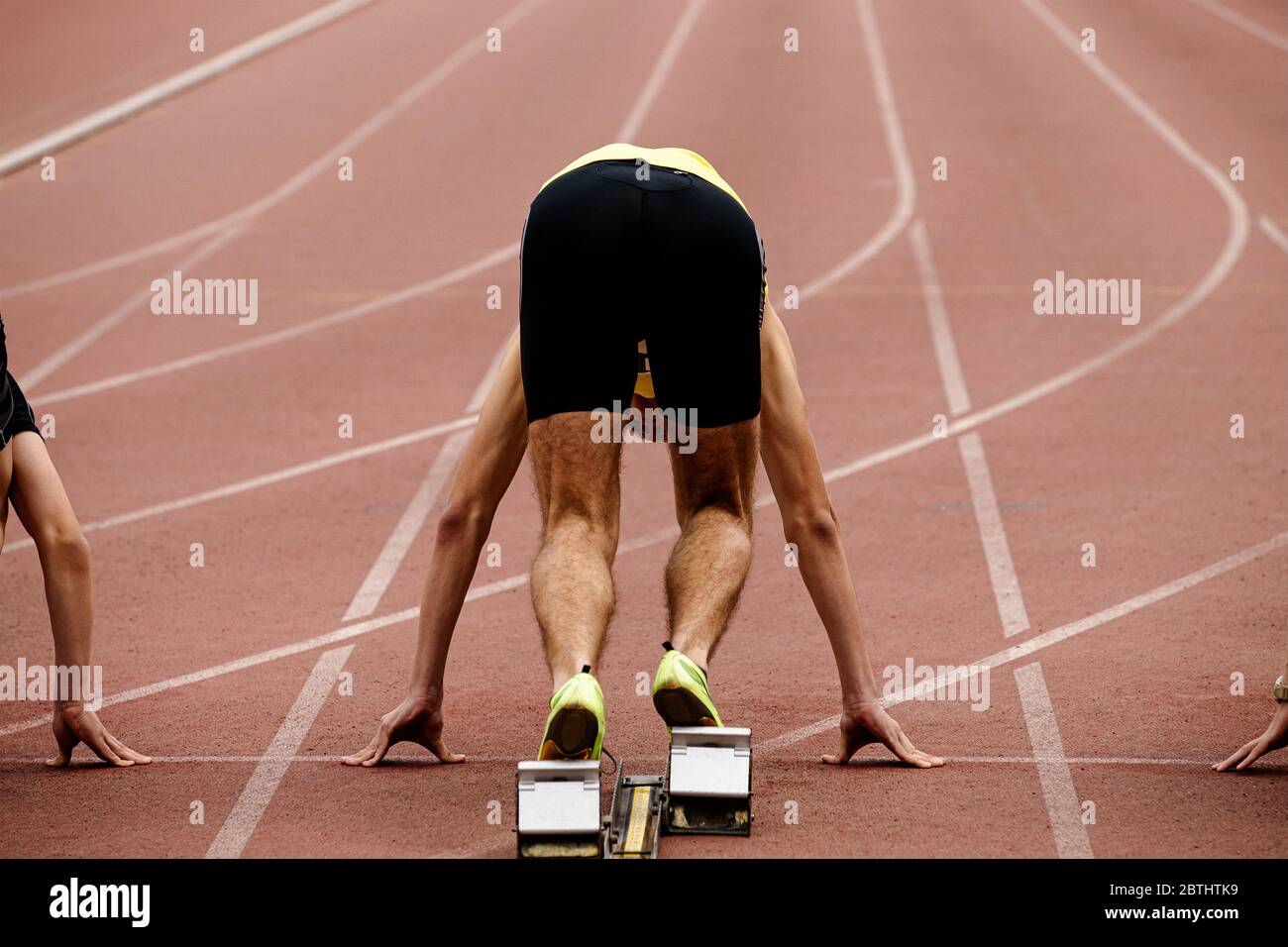 Male sprinter in blocks hires stock photography and images Alamy