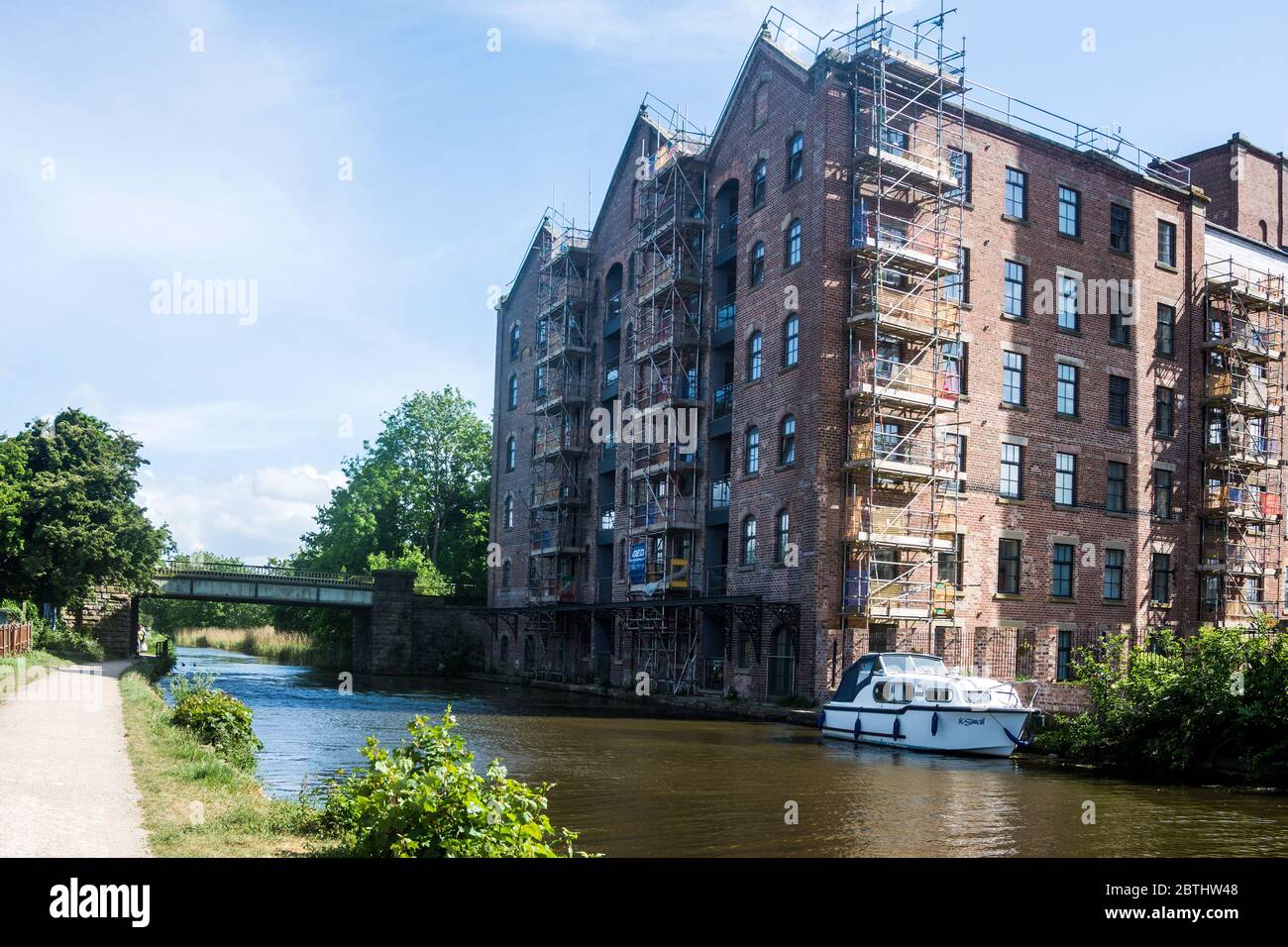 View of A former factory now converted into canalside apartments Stock Photo ...