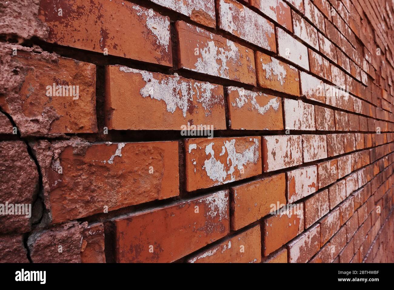 Old brick wall of red color, in perspective Stock Photo