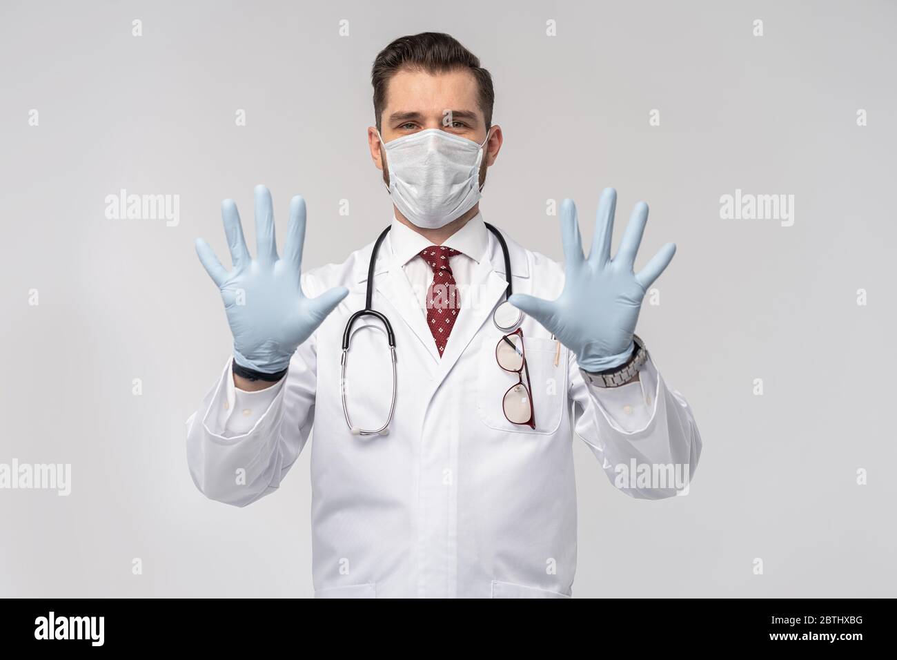 Coronavirus. COVID19 pandemic. Attractive handsome doctor in