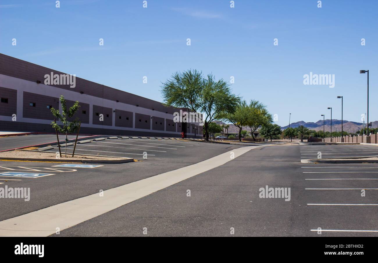 Empty High School Parking Lot Due To Coronavirus Quarantine Stock Photo