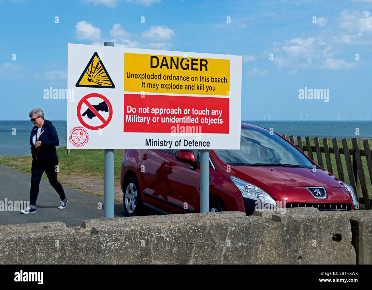 Ministry of Defence notice warning people about unexploded ordnance on the beach at Aldbrough, East Yorkshire, England UK Stock Photo