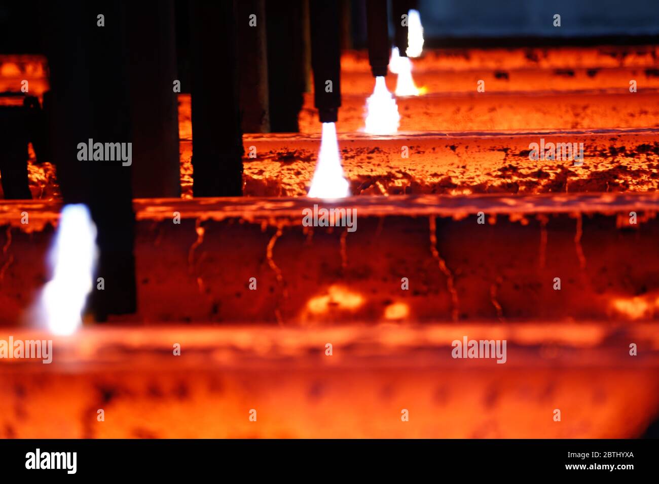 Hot steel bars in production in industrial steel plant Stock Photo