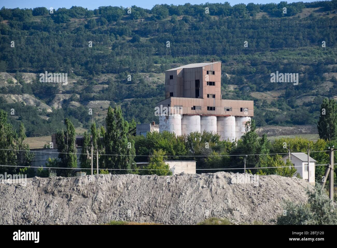 An old abandoned Soviet grain terminal. The grain elevator. Stock Photo