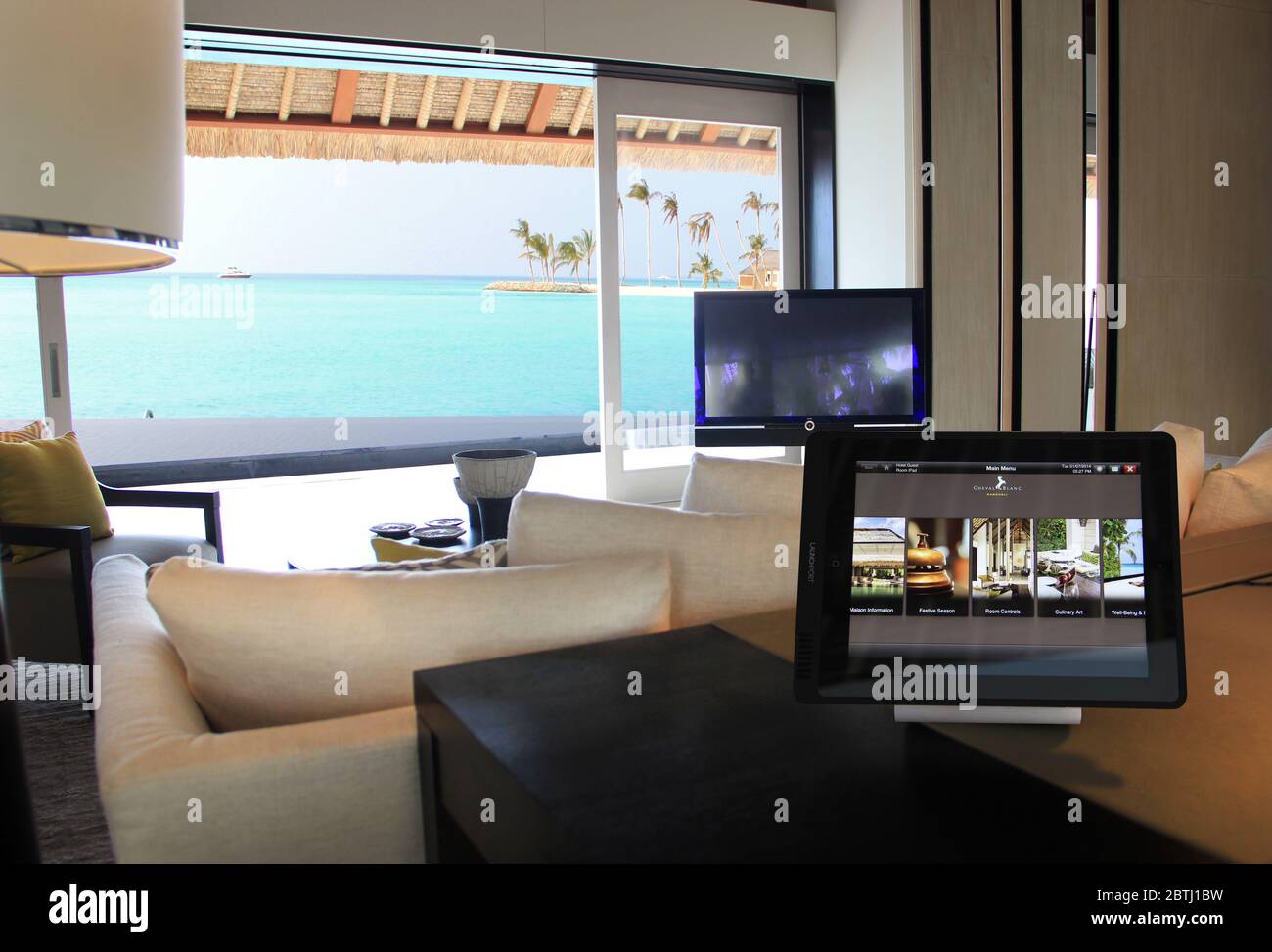 Modern living room with swimming pool and apple iPad Stock Photo - Alamy