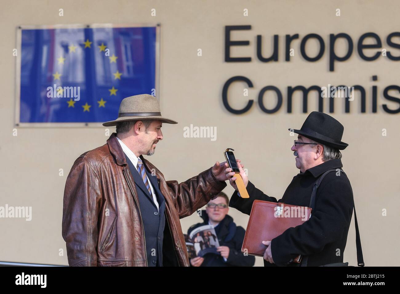People communicate near the European Commission building. Brussels, Belgium - 02 Mar 2011 Stock Photo