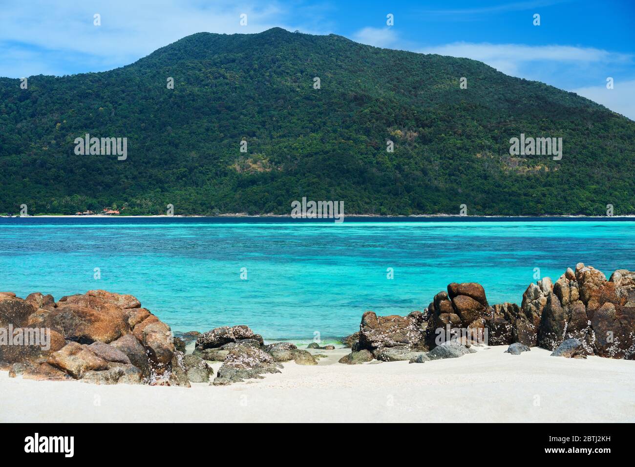 Turquoise clear sea and white sand beach on tropical island. Summer vacation, travel, nature background concept Stock Photo