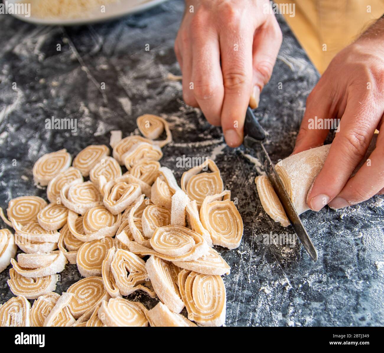 Prepare home made traditional pasta tagliatelle the authentic Italy recipe rolled dough Stock Photo