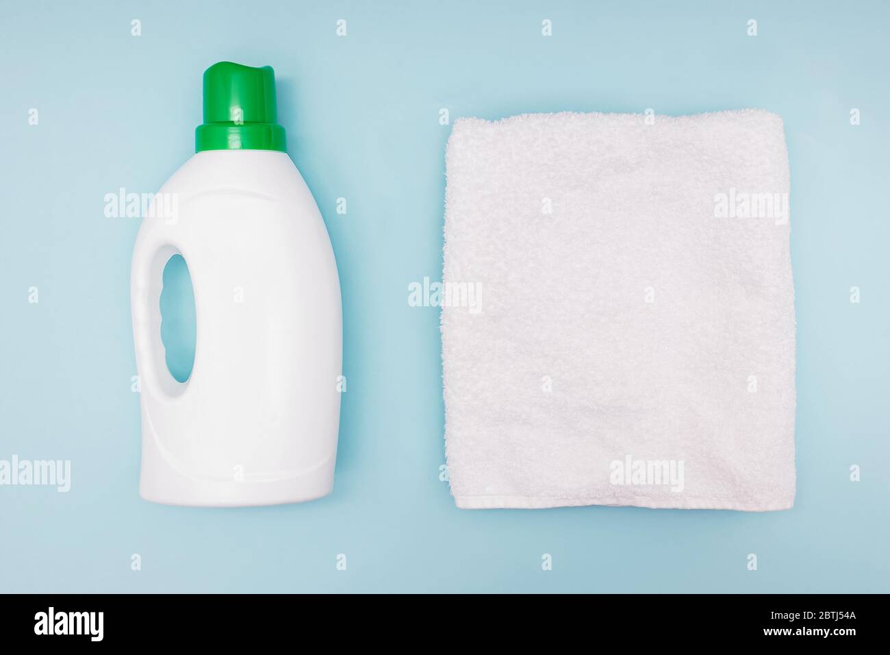 White towel and bottle of liquid detergent Stock Photo Alamy
