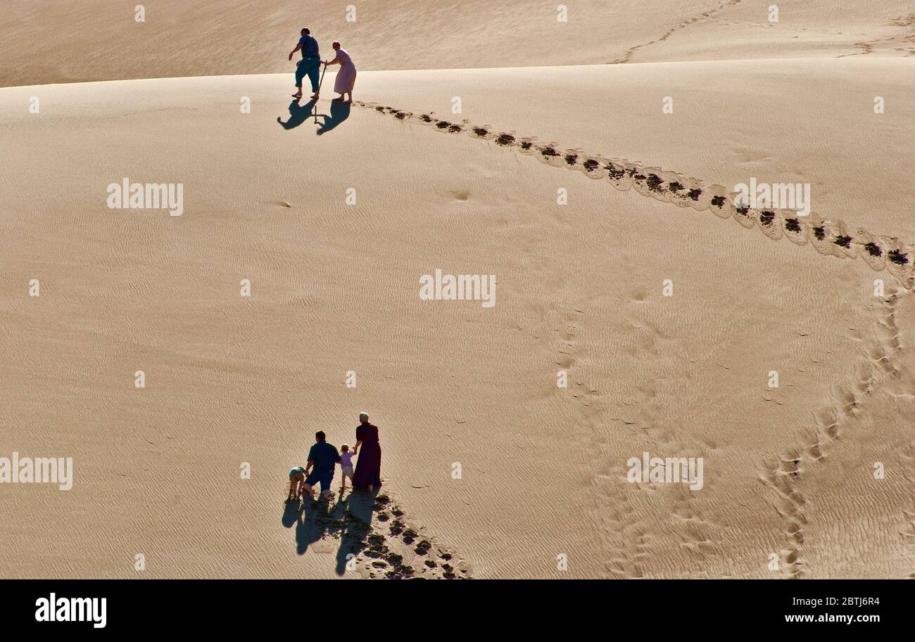 Climbing dunes over Castle Creek in Great Sand Dunes National Park