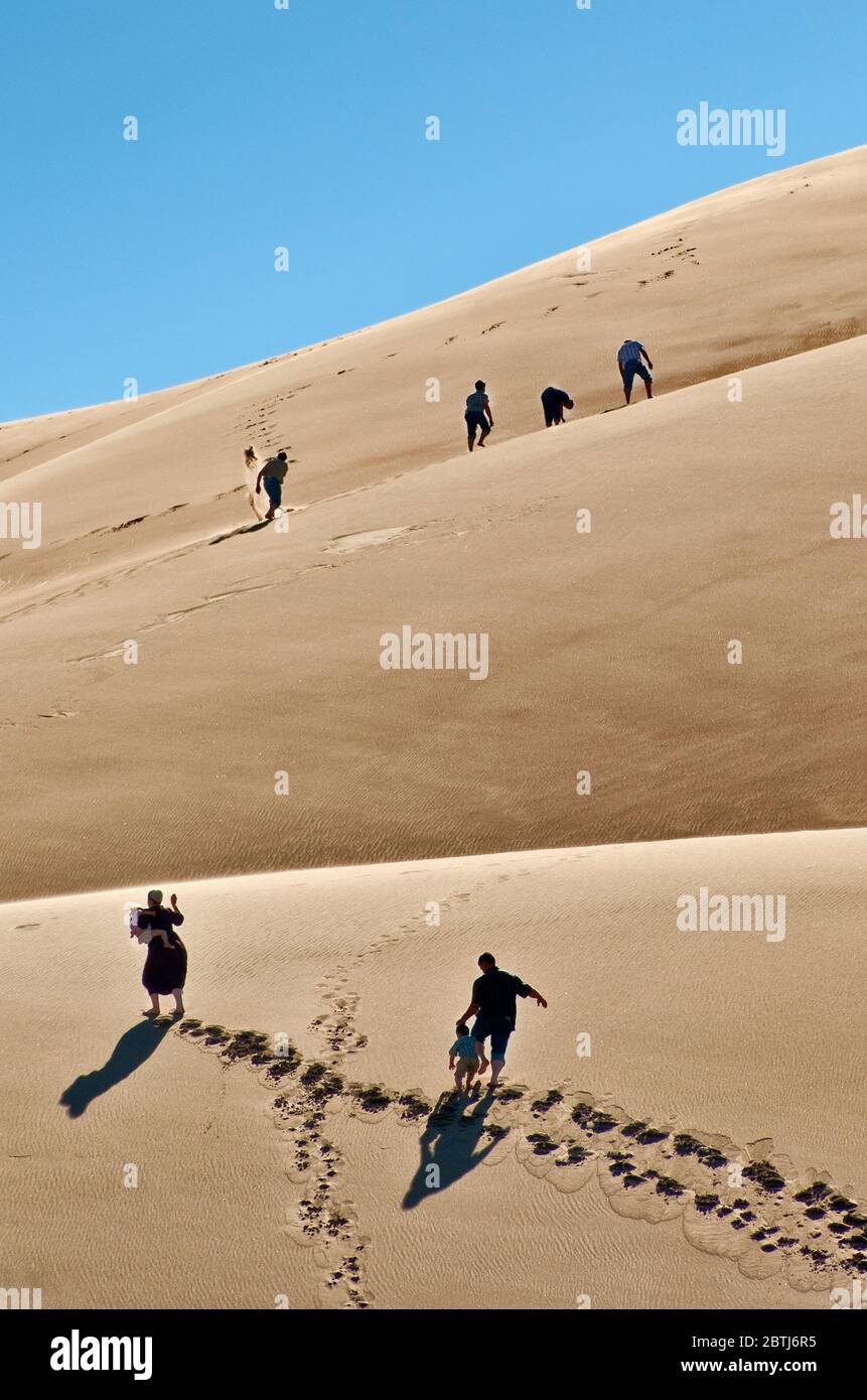 Climbing dunes over Castle Creek in Great Sand Dunes National Park