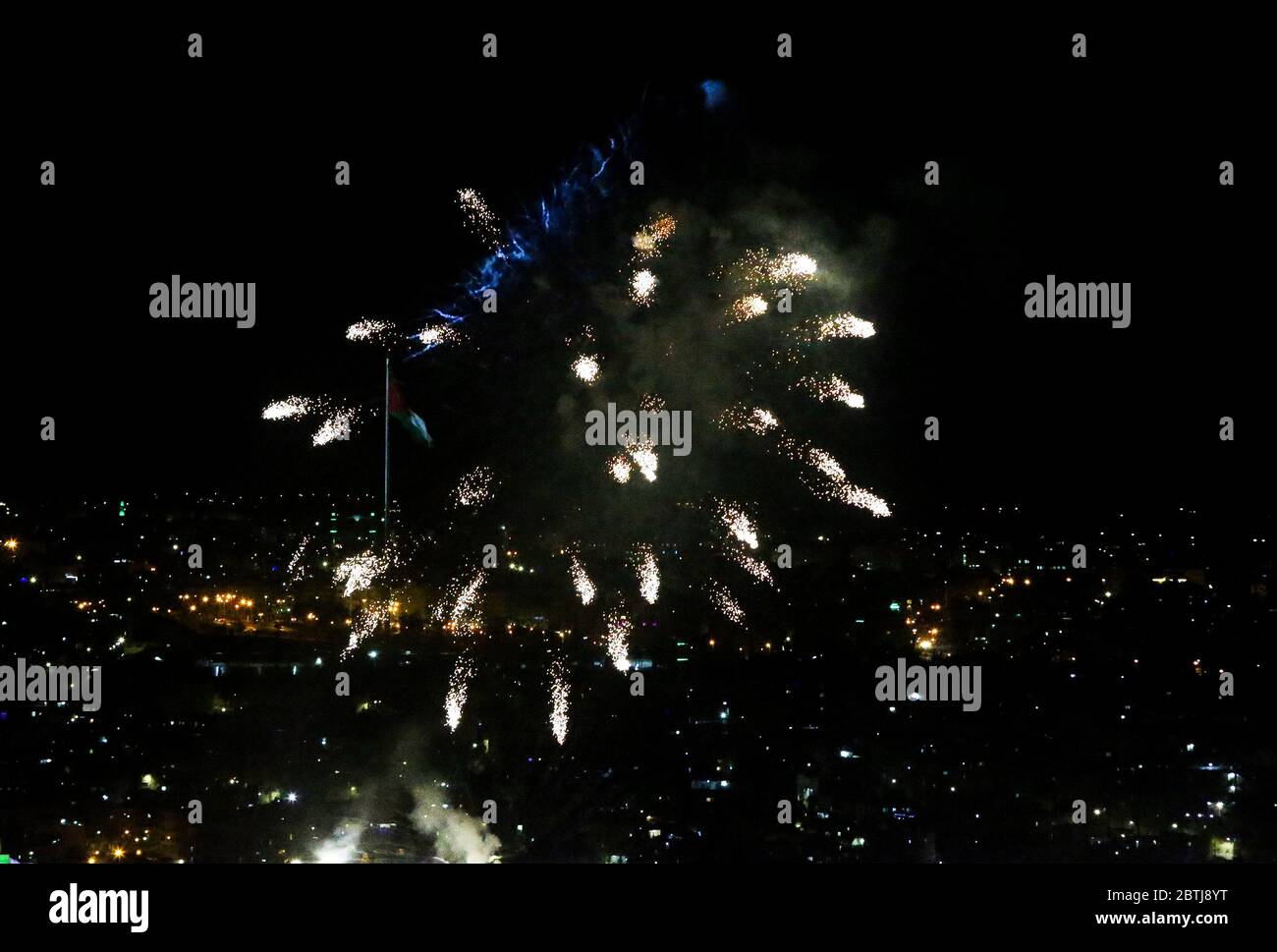 May 25, 2020: Amman, Jordan. 25 May 2020. Fireworks are displayed in Amman to celebrate the 74th anniversary of Jordan Independence Day. The commemoration of Jordan National Day, which is celebrated every year on 25th May, included fireworks, military parades, and a speech by King Abdullah II of Jordan. Independence Day marks the country's independence from British rule on 25 May 1946, and the following declaration of the Hashemite Kingdom of Jordan. The national flag was widely displayed to symbolise the significance of the day for the country (Credit Image: © Stringer/IMAGESLIVE via ZUMA Stock Photo