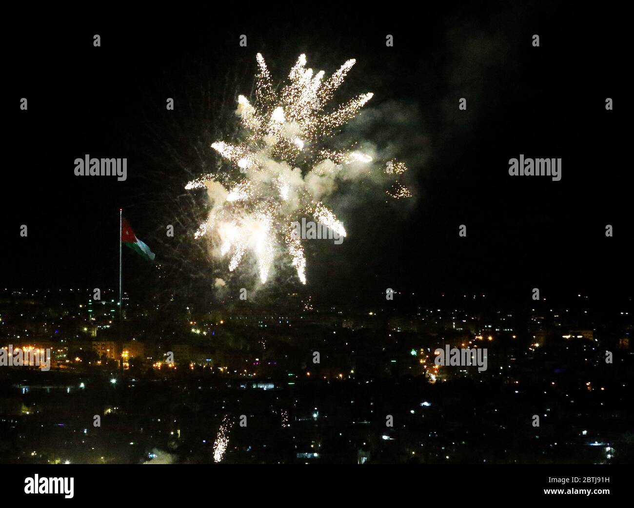 May 25, 2020: Amman, Jordan. 25 May 2020. Fireworks are displayed in Amman to celebrate the 74th anniversary of Jordan Independence Day. The commemoration of Jordan National Day, which is celebrated every year on 25th May, included fireworks, military parades, and a speech by King Abdullah II of Jordan. Independence Day marks the country's independence from British rule on 25 May 1946, and the following declaration of the Hashemite Kingdom of Jordan. The national flag was widely displayed to symbolise the significance of the day for the country (Credit Image: © Stringer/IMAGESLIVE via ZUMA Stock Photo